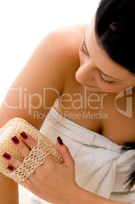 top view of woman scrubbing her arms on an isolated white background