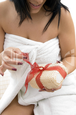 close up of woman posing with scrubber