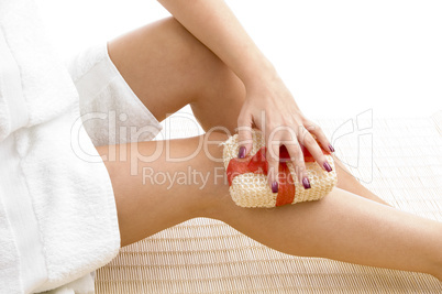 close view of female scrubbing her legs