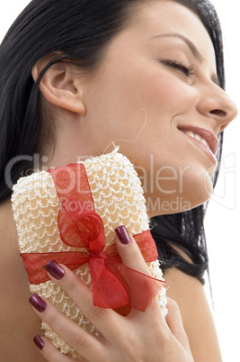close up of woman scrubbing her neck