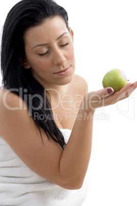 side view of woman posing with apple
