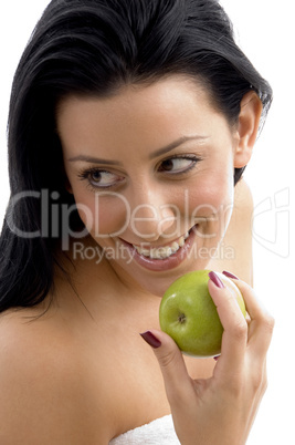 portrait of smiling female holding apple