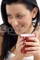 close up of smiling female holding coffee mug