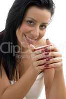 front view of smiling woman holding coffee mug