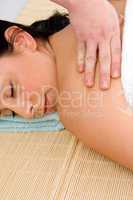 top view of woman taking back massage on white background