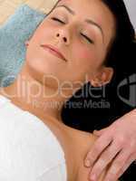 top view of female taking massage against white background