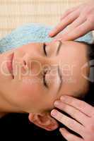 high angle view of woman taking head massage on white background