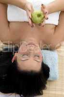 high angle view of smiling woman holding apple