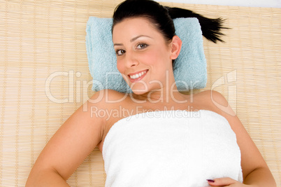 top view of relaxing female against white background