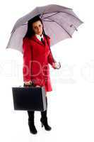 american woman holding an umbrella and office bag