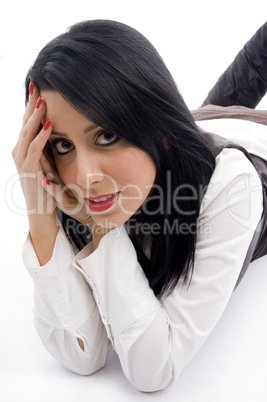 model lying down on floor and looking at camera