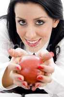 female holding an apple