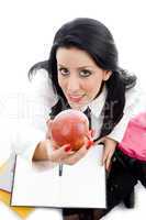 student holding an apple