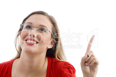 model smiling and pointing upwards