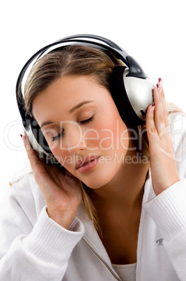 young female busy with music