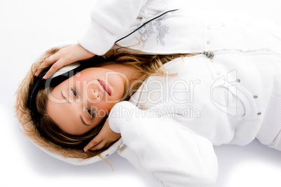 young model lying and listening to music