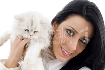 young model standing with white kitten