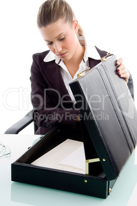 blonde woman looking into suitcase