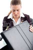 woman looking into suitcase