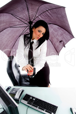 female holding umbrella and posing