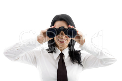 young businesswoman looking through binocular