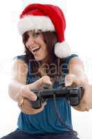 brunette female with christmas hat and remote
