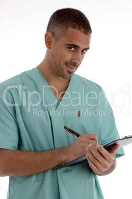 doctor writing on notepad