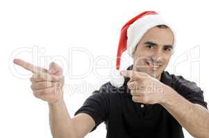 pointing man with christmas hat