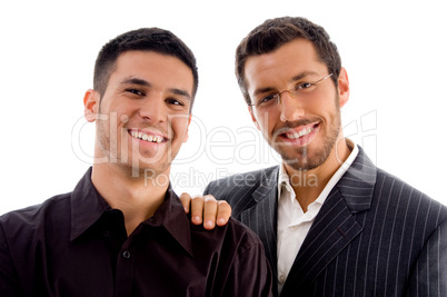 happy businesspeople standing together and looking at camera