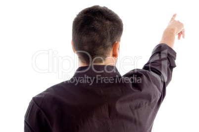 young guy pointing and posing from back