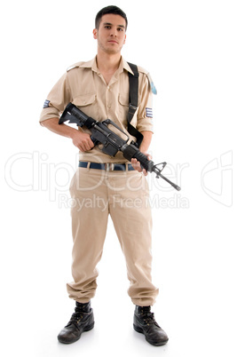 standing young soldier with gun