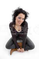 smiling female sitting on ground