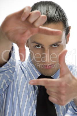 businessman making frame with hand gesture