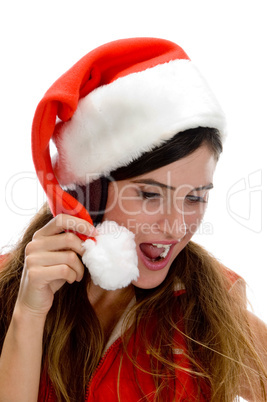 woman with santa cap and looking downward