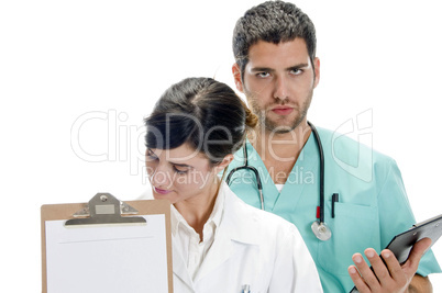 medical professionals with paper in writing board