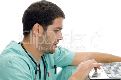 doctor with laptop looking you