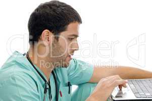 doctor with laptop looking you