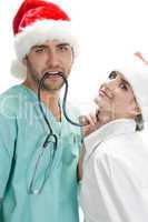 posing medical professionals with stethoscope and santa cap