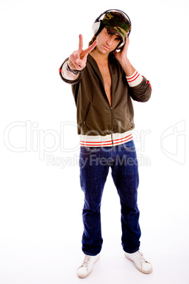full body of man wearing headphone and showing peace sign