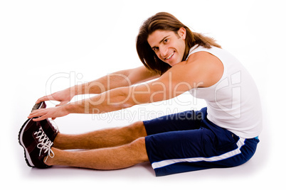 side view of exercising man looking at camera