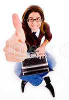 top view of smiling man with thumbs up and laptop