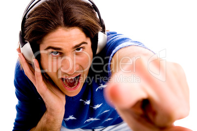 top view of shouting male enjoying music and pointing