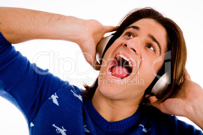 portrait of shouting male enjoying music