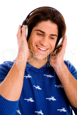 portrait of smiling man listening music