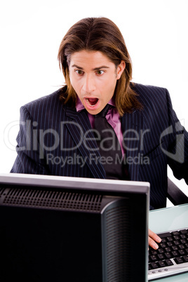 front view of shocked manager looking at screen