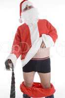 santa clause holding his coat and belt