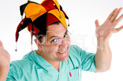 adult doctor wearing colorful hat giving screaming expression