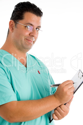 experienced doctor writing prescriptions