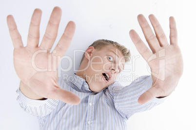 shouting young guy with open palms
