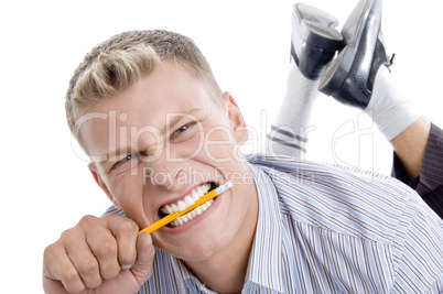 man holding pencil with teeth